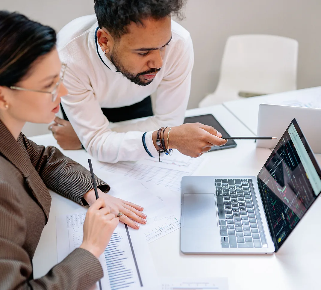 Business owner reviewing a dashboard with their team
